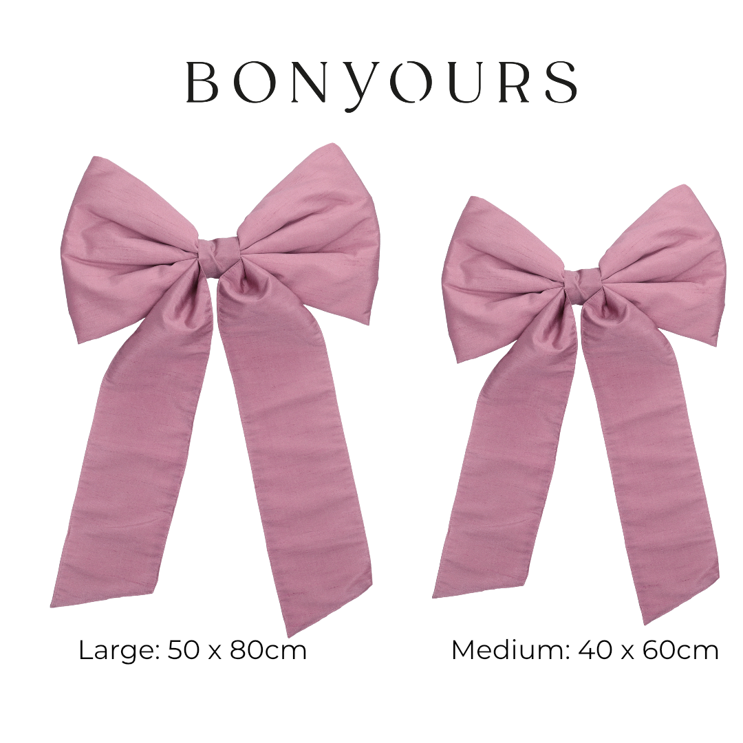 Twee roze strikformaten large medium